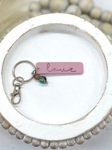 “Love” clay keychain